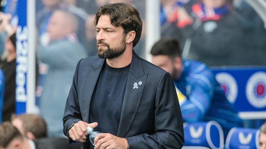 Russell Martin with a bottle of water on the Ibrox touchline