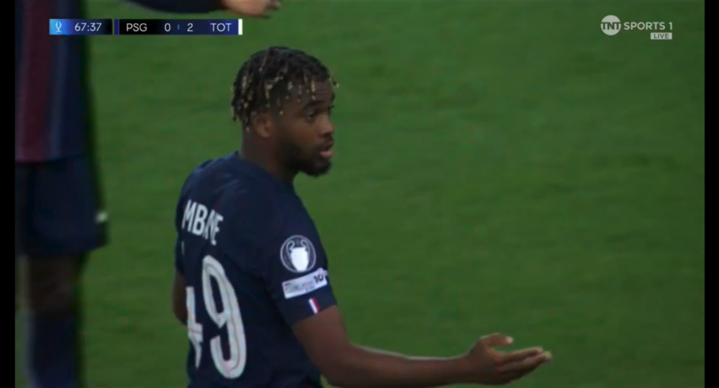 PSG's Mbaye holding his arm up in the air