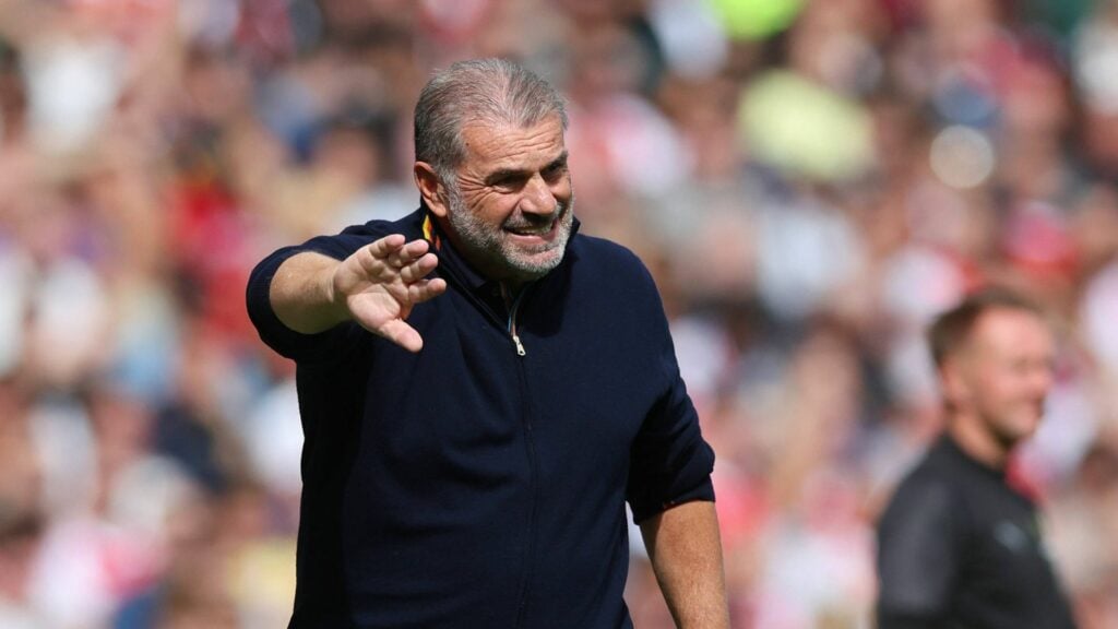 Ange Postecoglou coaching his players from the sideline.