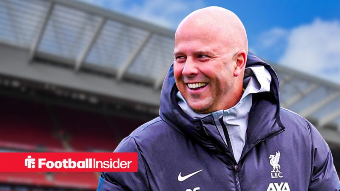 Arne Slot in a happy mood against a back drop of Anfield