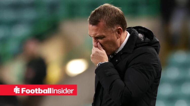 Brendan Rodgers with his hand covering his face looking gutted
