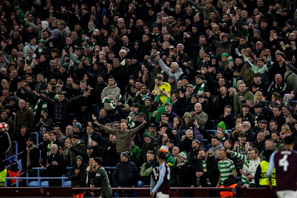 Celtic fans celebrate a goal