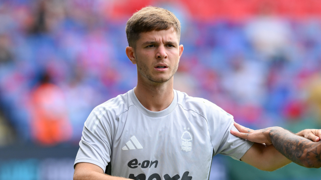 James McAtee frowns while warming up before a Nottingham Forest game