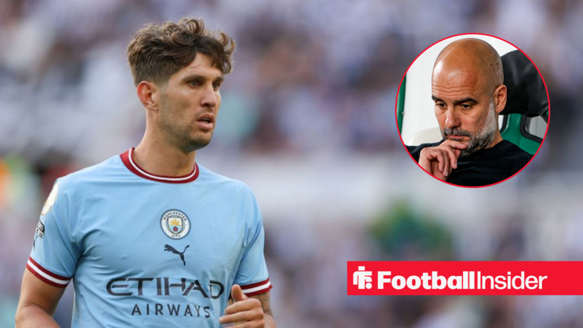 John Stones in blue Man City shirt with Pep Guardiola looking sad