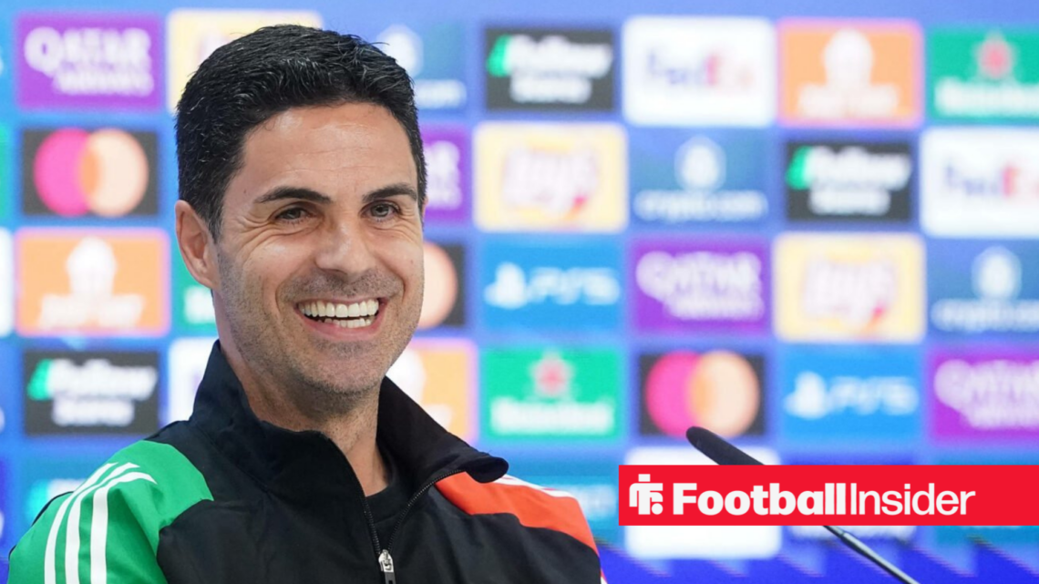 Mikel Arteta at a press conference in a happy mood.