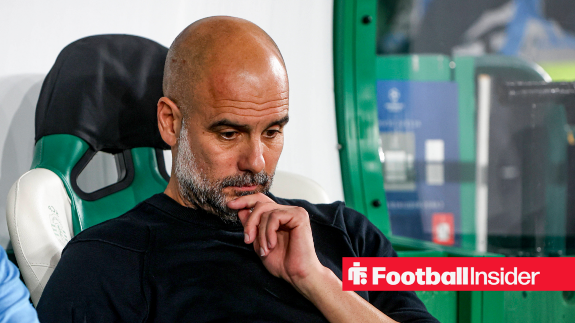 Pep Guardiola looking upset sat on the bench