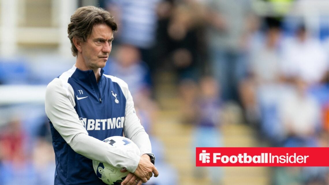 Tottenham manager Thomas Frank watching a warm up, with a ball in his hand