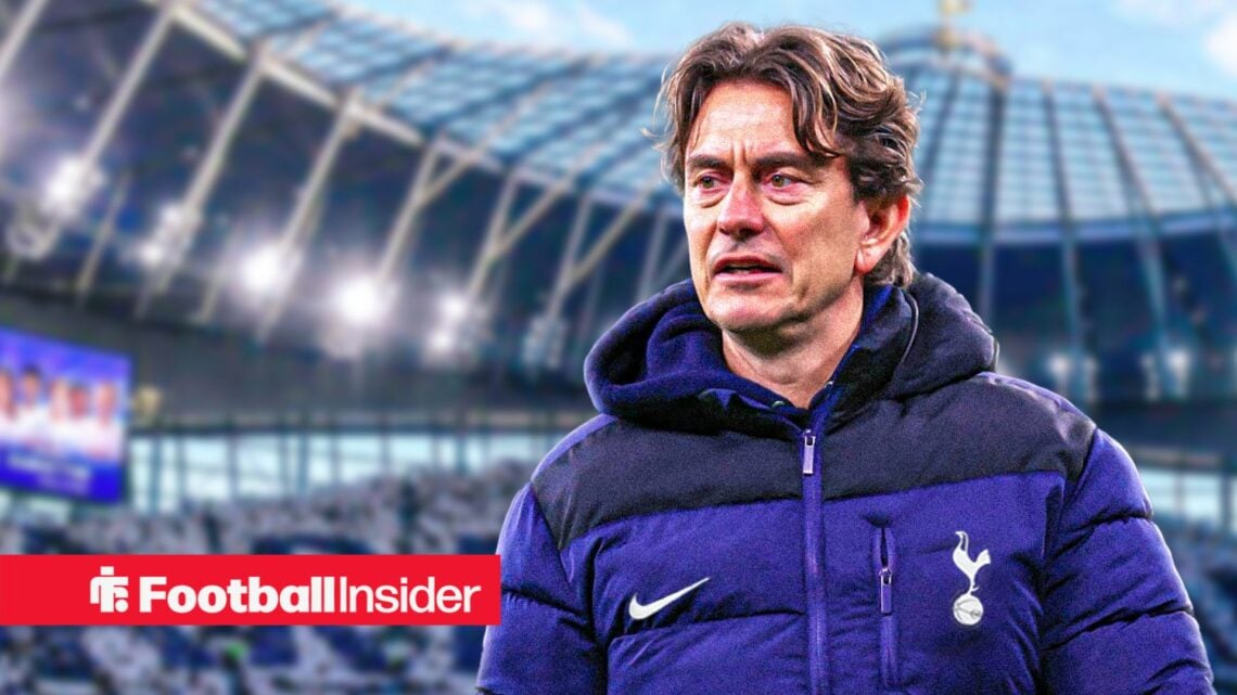 Tottenham manager Thomas Frank against a backdrop of the Tottenham Hotspur Stadium.