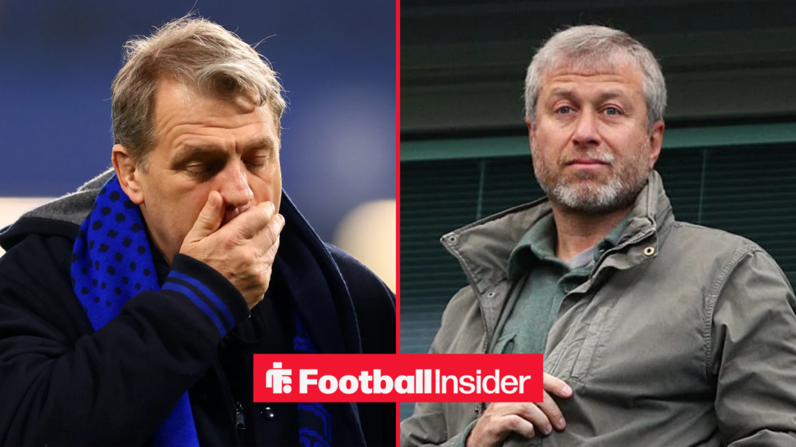 Todd Boehly looking upset alongside Roman Abramovich in a green jacket