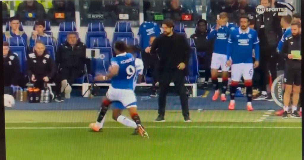 Youssef Chermiti fouling a Genk player with Russell Martin on the sidelines