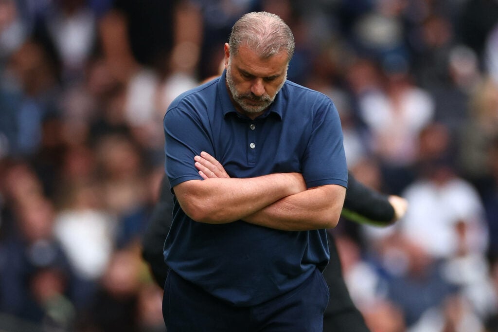 Ange Postecoglou looking to the ground in disappointment