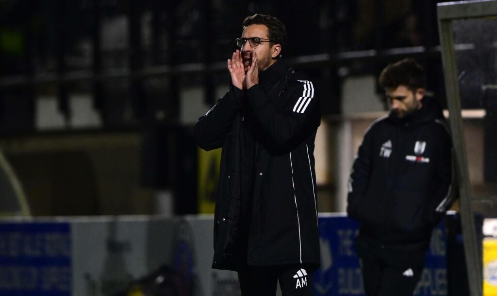 Ali Melloul on the touchline shouting instruction to Fulham's players.