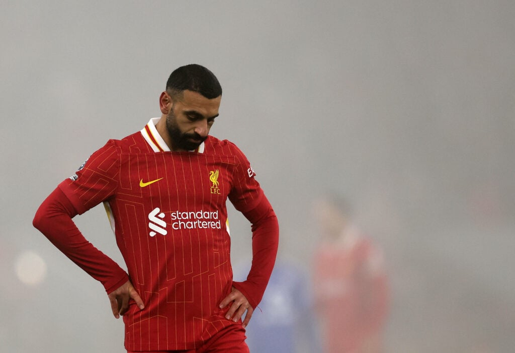 Mohamed Salah looks dejected in a Liverpool kit