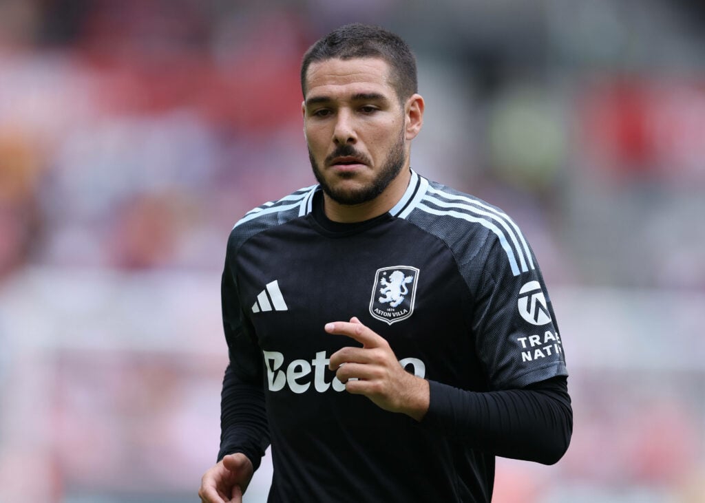 Emiliano Buendia running whilst looking focused for Aston Villa