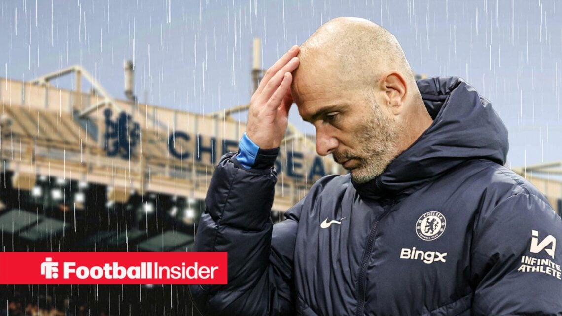 Chelsea manager Enzo Maresca with a hand on his head against a backdrop of a rainy Stamford Bridge