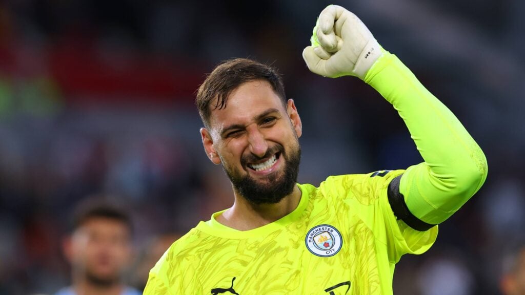 Gianluigi Donnarumma celebrating in a Man City goalkeeper shirt