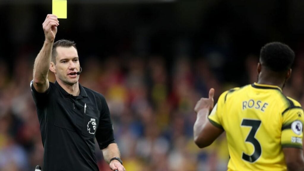 Jarred Gillett showing a yellow card