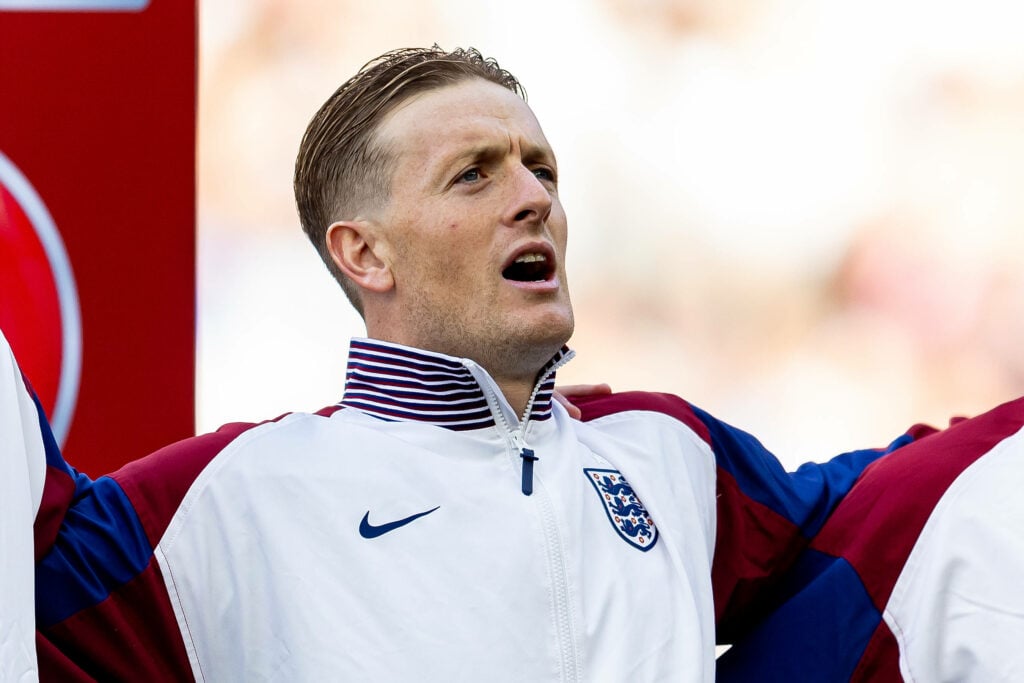 Jordan Pickford singing the national anthem for England.
