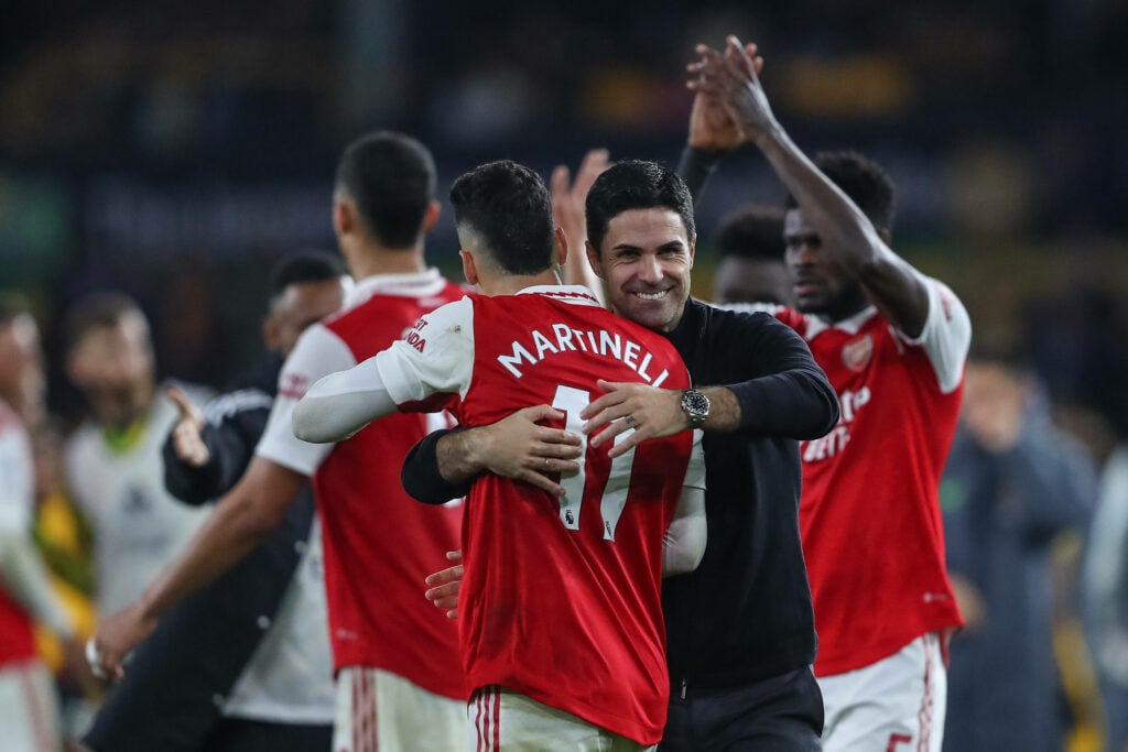 Gabriel Martinelli hugging a smiling Mikel Arteta