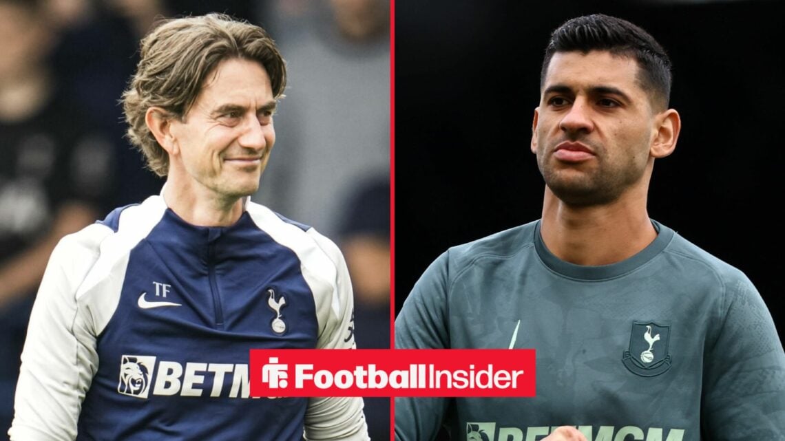 Tottenham boss Thomas Frank smiling at captain Cristian Romero who looks back annoyed