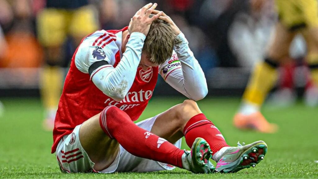 Martin Odegaard with his hands on his head after picking up a new injury