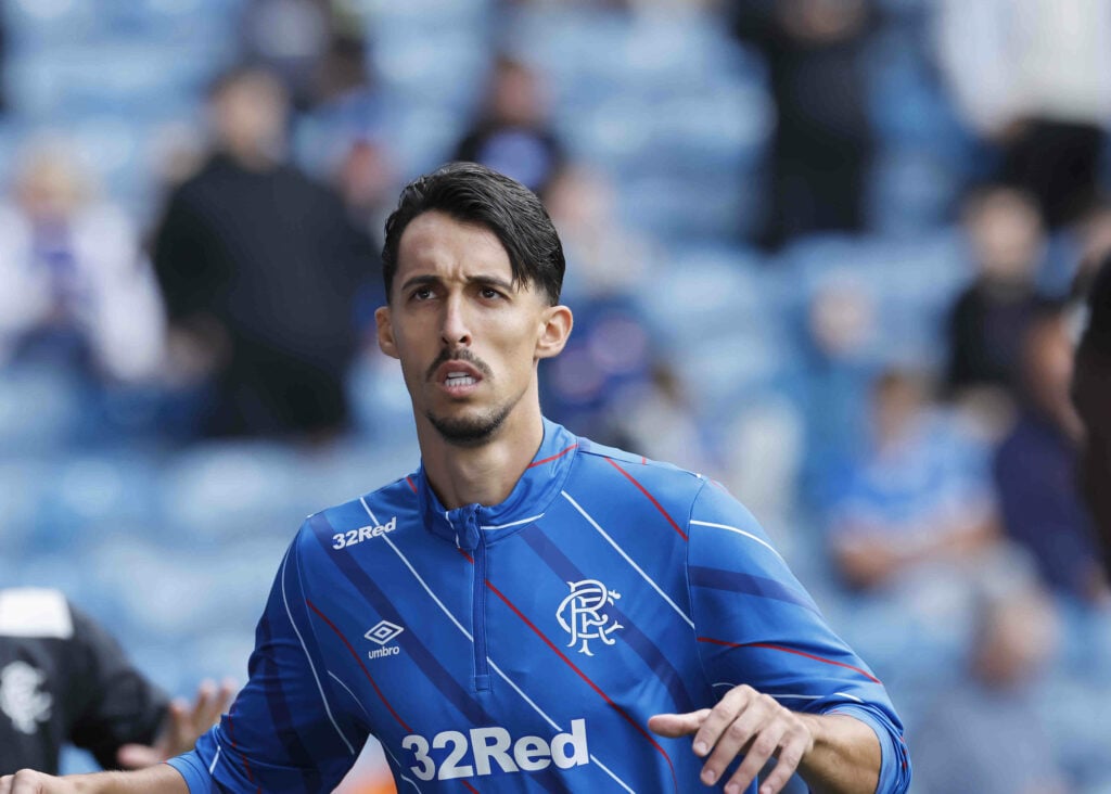 Bojan Miovski looking focused in a blue Rangers shirt