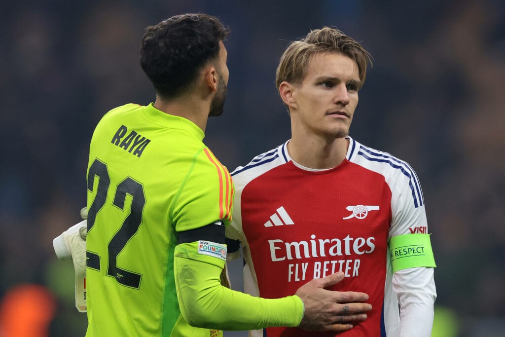 David Raya and Martin Odegaard embracing.