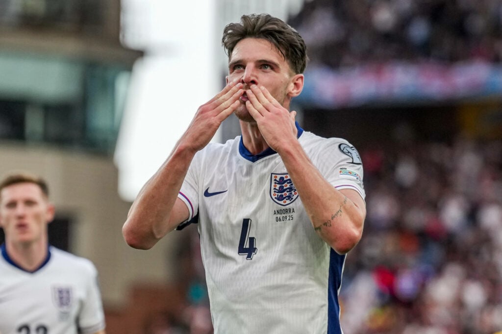 Declan Rice playing for England, kissing his hand to imitate blowing a kiss for the fans.
