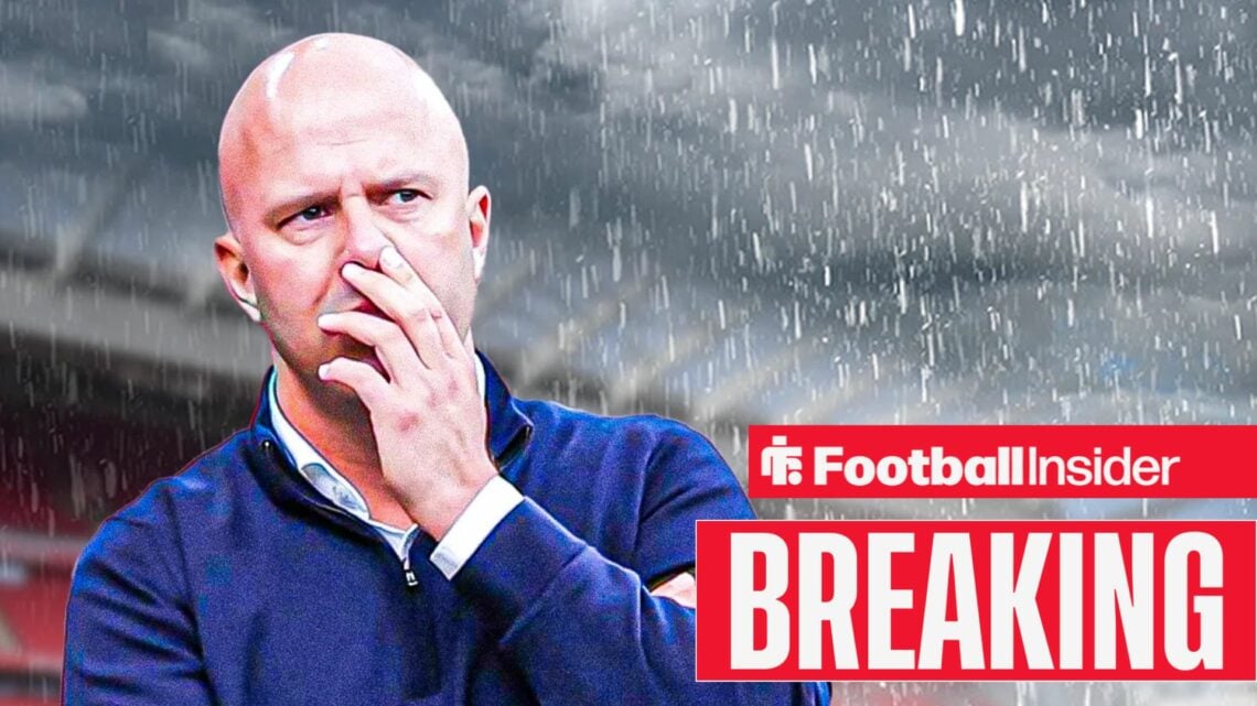 Arne Slot in the rain at Anfield