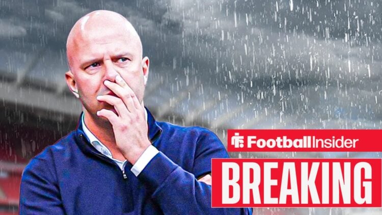 Arne Slot in the rain at Anfield