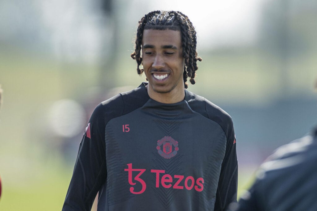 Leny Yoro smiling in a Man United shirt