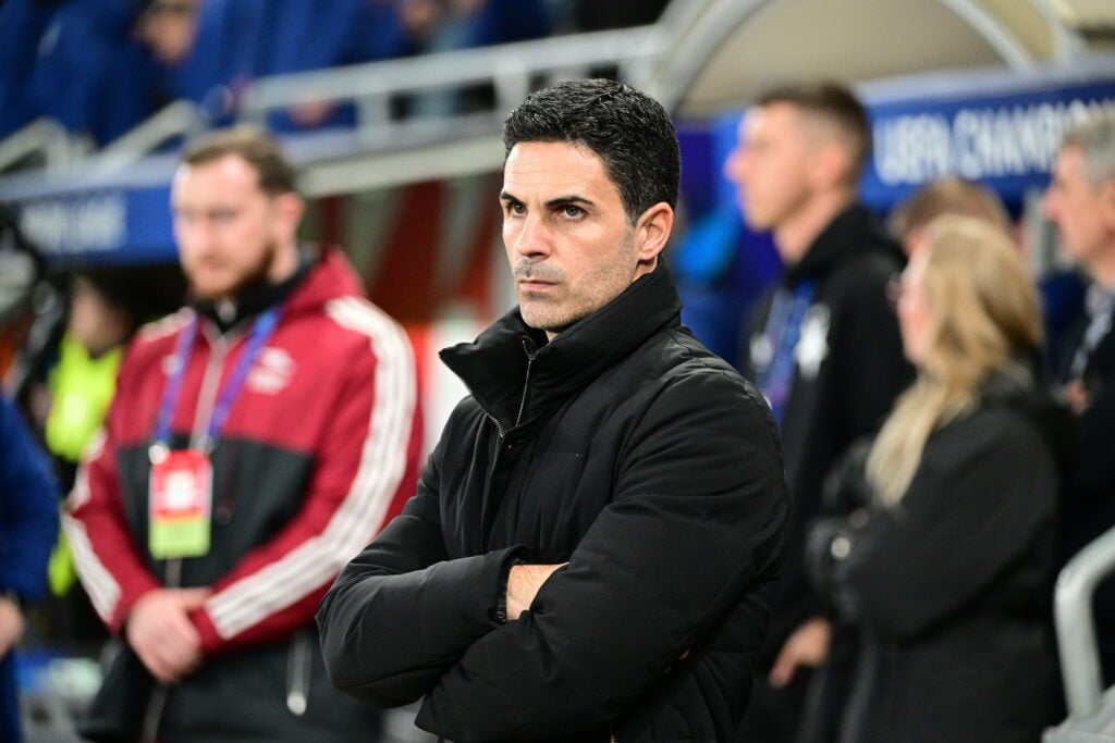 Arsenal manager Mikel Arteta stands with his arms folded on the touchline.