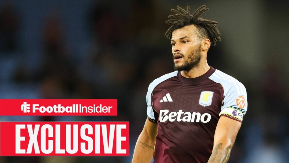 Tyrone Mings in action for Aston Villa with breaking news banner