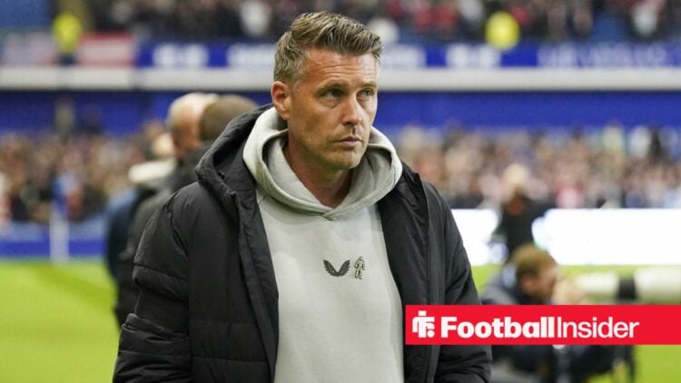 Ex-Middlesbrough manager Rob Edwards stands looking nervous on the touchline.