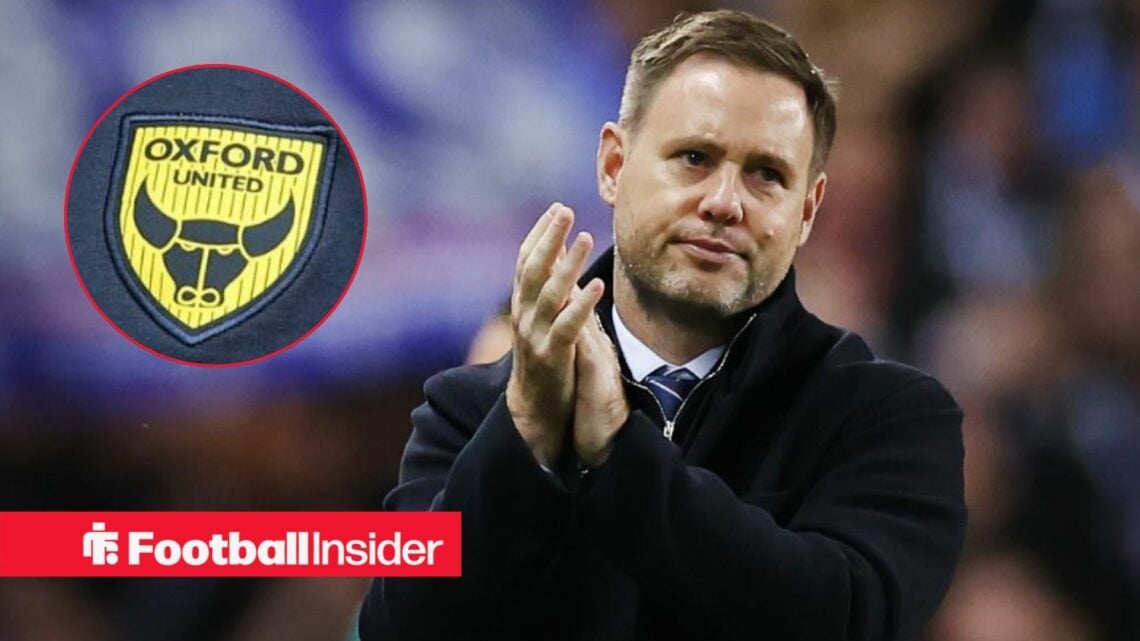 Michael Beale clapping towards Oxford United badge in circle