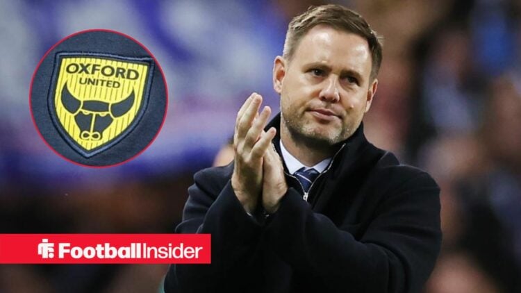 Michael Beale clapping towards Oxford United badge in circle