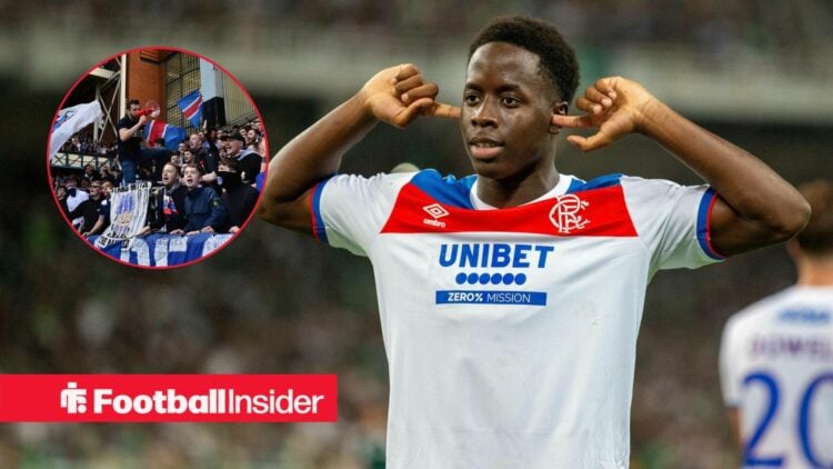 Djeidi Gassama celebrates a goal with his fingers in his ears, as Rangers fans feature in a circular inset.