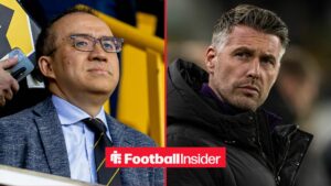 Jeff Shi at Molineux alongside Rob Edwards looking concerned