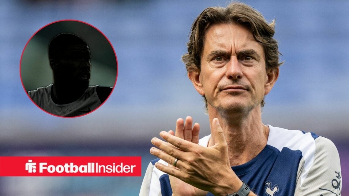 Kevin Danso's silhouette on the left with Thomas Frank nervously clapping on the right