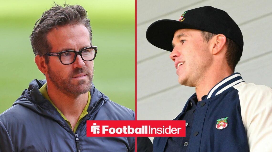 Ryan Reynolds at the Racecourse Ground alongside Rob Mac wearing a Wrexham jacket