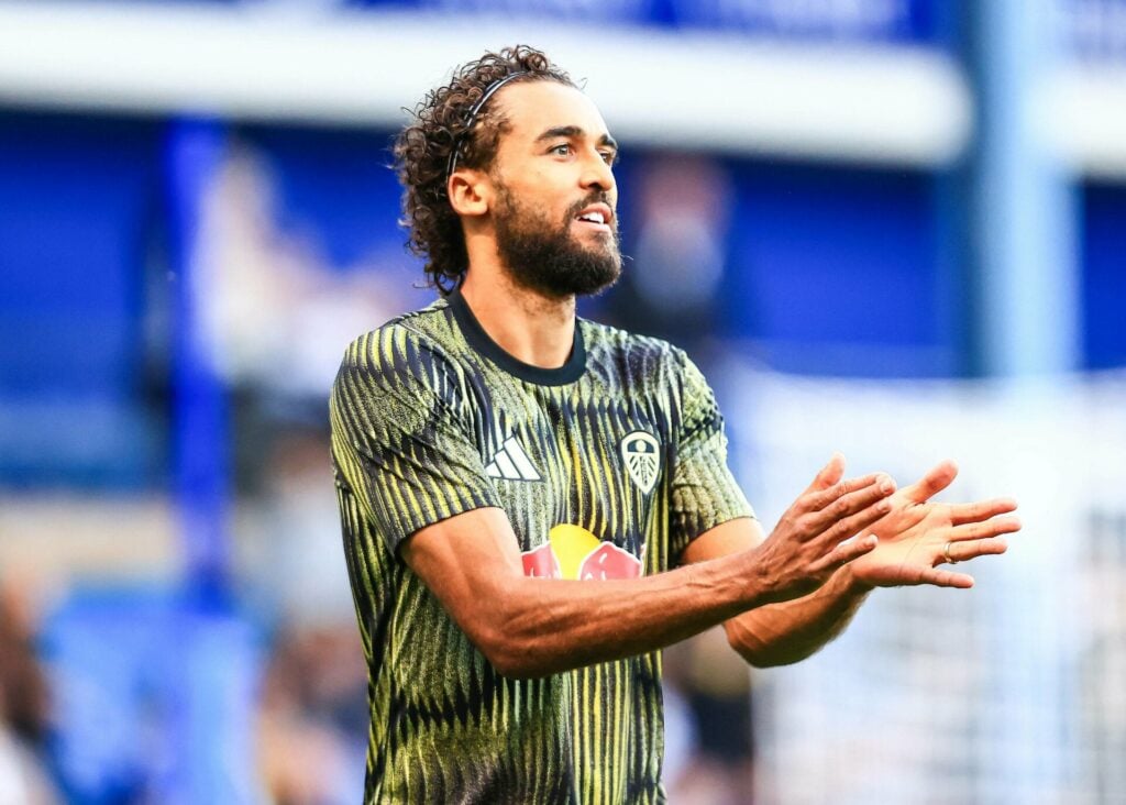 Dominic Calvert-Lewin applauds while warming up for Leeds United.