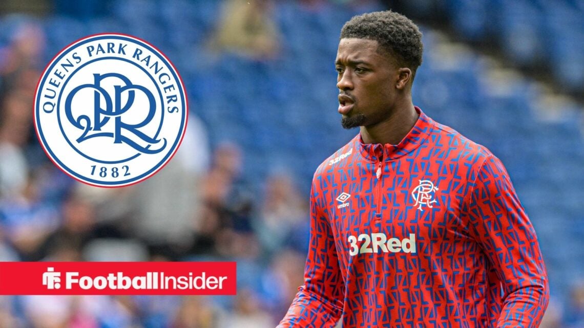 Emmanuel Fernandez looking at QPR badge