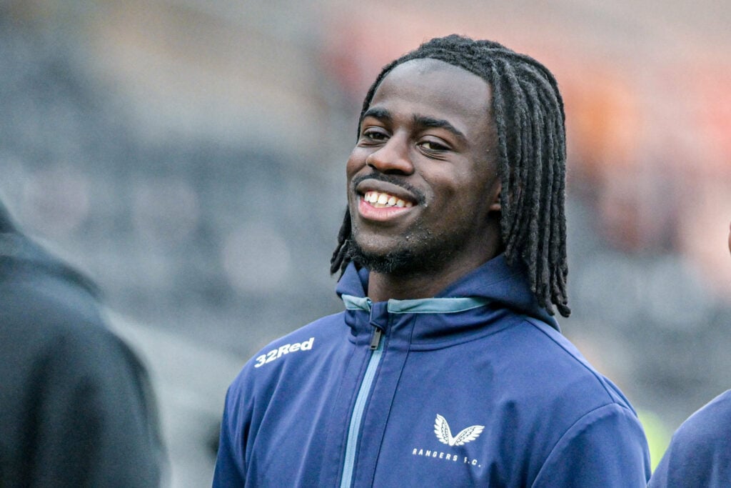 Rangers starlet Clinton Nsiala smiles as he arrives for a game.