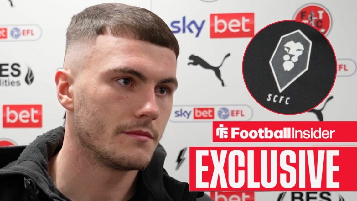 Football Insider exclusive as Fleetwood Town striker Ryan Graydon stares towards the Salford City badge, which features in a circular inset.