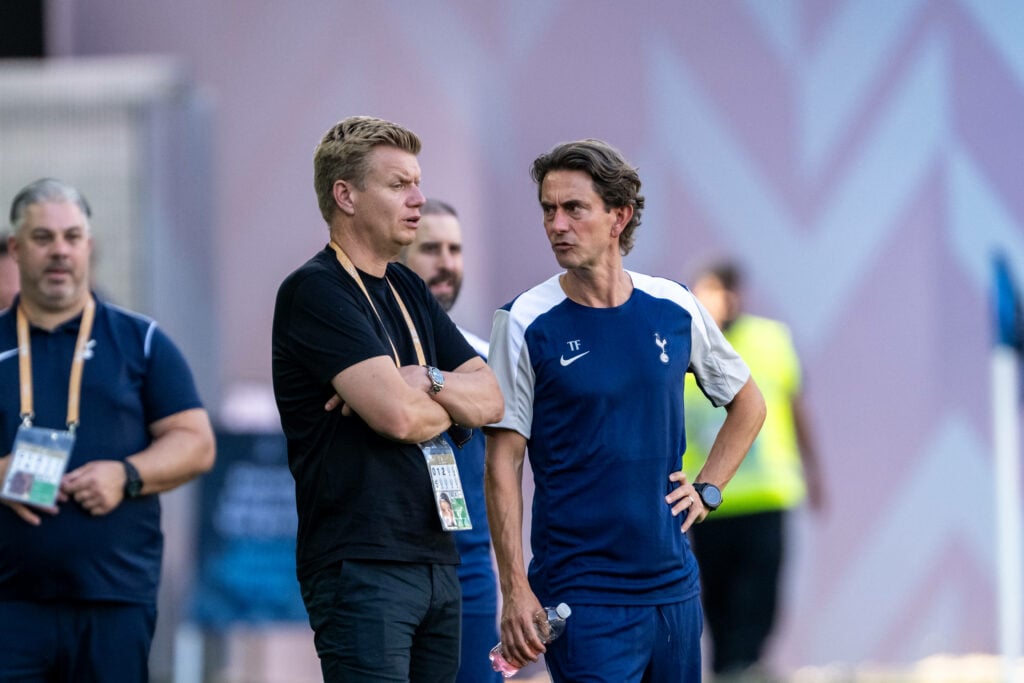 Tottenham manager Thomas Frank looks concerned while speaking to sporting director Johan Lange.
