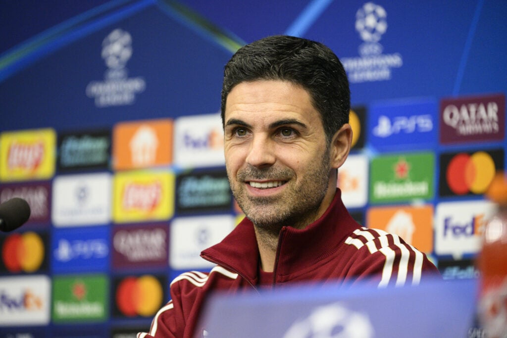 Arsenal manager Mikel Arteta smiling in a press conference