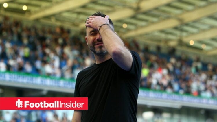 Former Marseille manager Roberto De Zerbi slaps his head and smiles