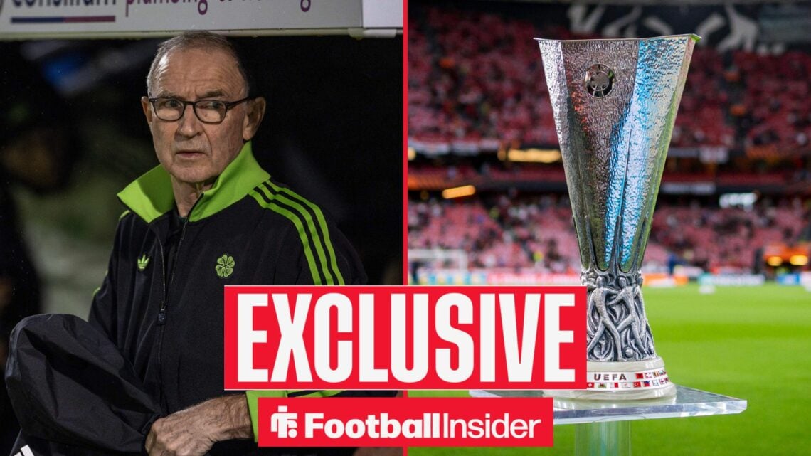 Martin O'Neill looking at Europa League trophy on right