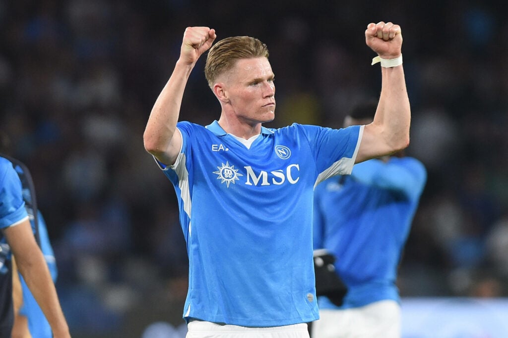Scott McTominay celebrates with his fists in the air for Napoli.