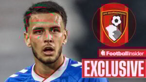 Enzo Le Fee playing for Bournemouth looking towards a circle inset of the Bournemouth badge